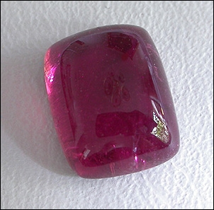 RED TOURMALINE SUGARLOAF CABOCHON (BRAZIL) – 2.89 CT.